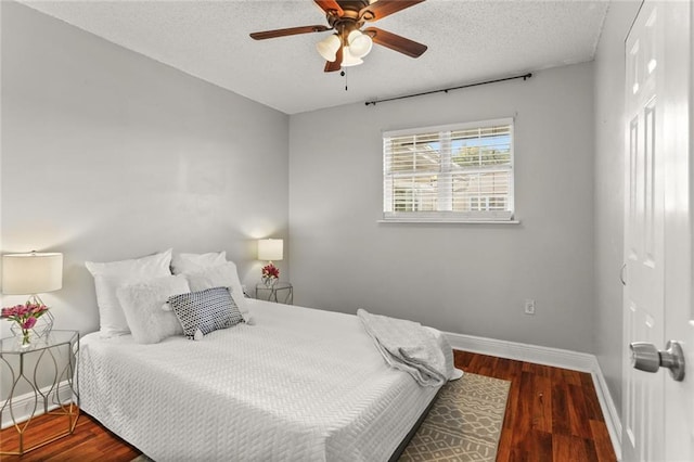 6020 Loraine St, Metairie, LA 70003 - bedroom featuring baseboards, wood finished floors, a textured ceiling, and a ceiling fan