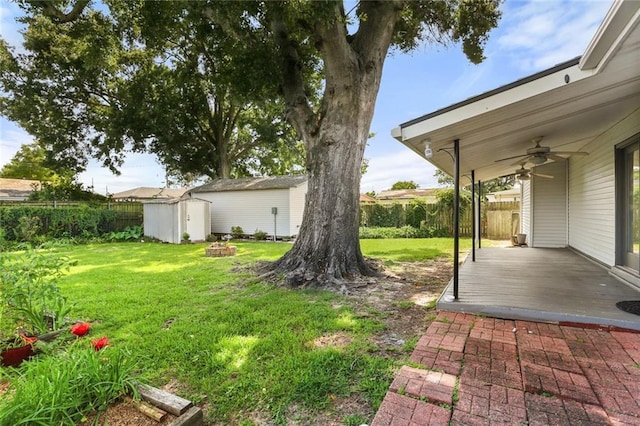 6020 Loraine St, Metairie, LA 70003 - view of yard featuring ceiling fan, a deck, and an outdoor fire pit