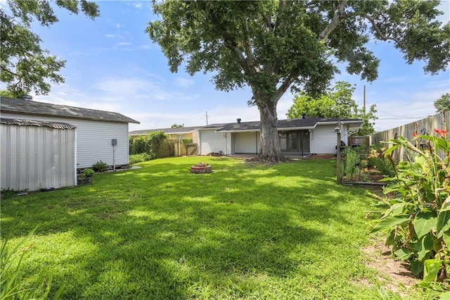 6020 Loraine St, Metairie, LA 70003 - view of yard featuring an outdoor fire pit