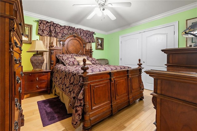6755 Lake Willow Dr, New Orleans, LA 70126 - bedroom with light wood-type flooring, ornamental molding, a ceiling fan, and a closet