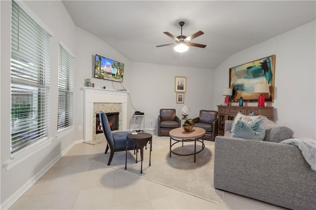 11537 Woodbluff Dr, Covington, LA 70433 - living room featuring a premium fireplace, vaulted ceiling, a ceiling fan, and baseboards