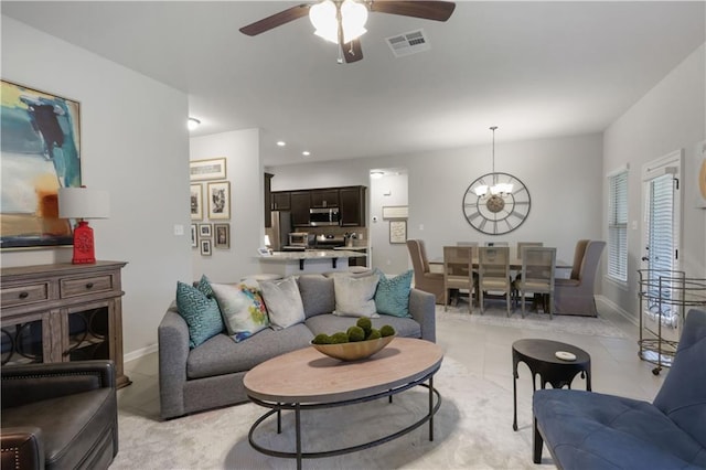 11537 Woodbluff Dr, Covington, LA 70433 - living area with light tile patterned floors, a chandelier, a ceiling fan, baseboards, and recessed lighting