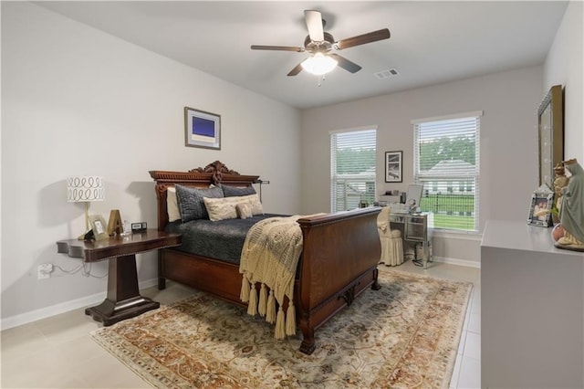 11537 Woodbluff Dr, Covington, LA 70433 - tiled bedroom with baseboards and ceiling fan