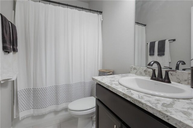 11537 Woodbluff Dr, Covington, LA 70433 - full bath featuring vanity, toilet, and tile patterned floors