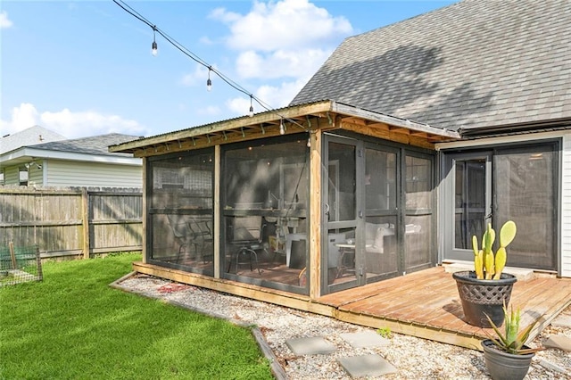 352 Moonraker Dr, Slidell, LA 70461 - back of house featuring a sunroom, a shingled roof, and a deck