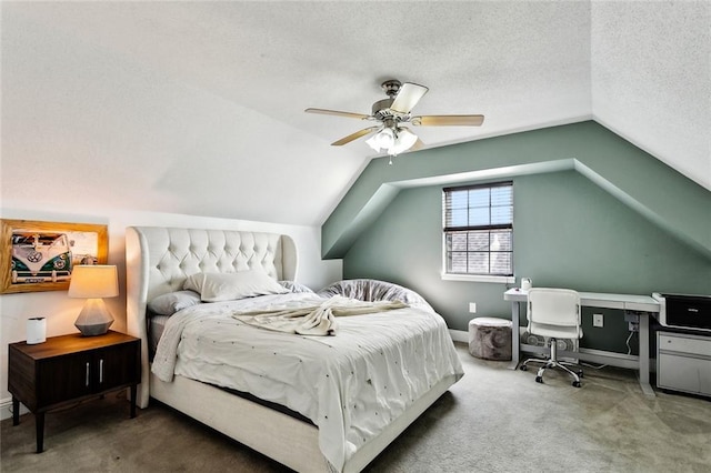 352 Moonraker Dr, Slidell, LA 70461 - carpeted bedroom with vaulted ceiling, a desk, baseboards, a ceiling fan, and a textured ceiling