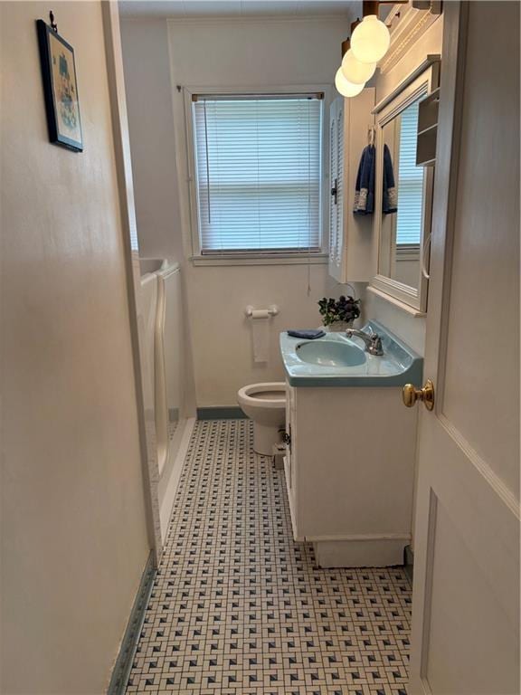 905 Lurline Dr, Jefferson, LA 70121 - bathroom featuring vanity, toilet, a shower, and baseboards