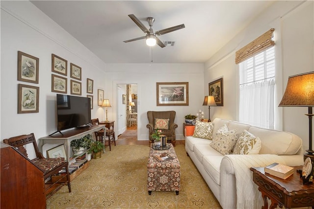 905-907 Pelican Ave, New Orleans, LA 70114 - living room featuring a ceiling fan and baseboards