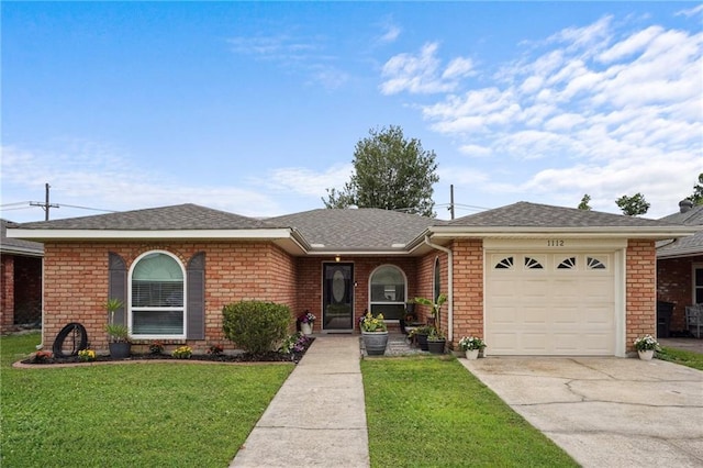 1112 Michigan Ave, Kenner, LA 70062 - ranch-style home with concrete driveway, a front yard, a garage, and brick siding