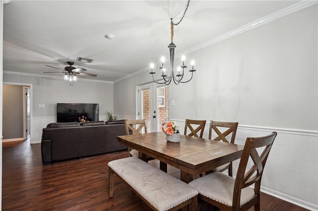 1112 Michigan Ave, Kenner, LA 70062 - dining room with dark wood-style flooring, wainscoting, a chandelier, crown molding, and ceiling fan