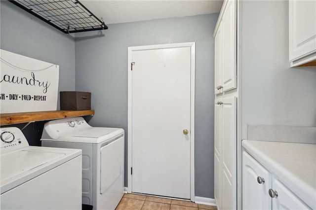 1112 Michigan Ave, Kenner, LA 70062 - laundry area with independent washer and dryer, cabinet space, light tile patterned floors, and baseboards