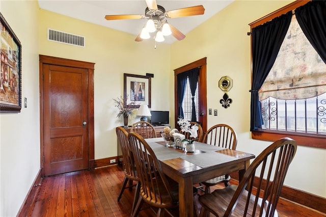 115 N Scott St, New Orleans, LA 70119 - dining room with baseboards, dark wood-style floors, and healthy amount of natural light