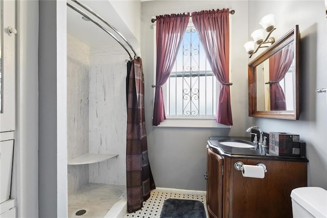 115 N Scott St, New Orleans, LA 70119 - bathroom featuring toilet, vanity, and a shower with shower curtain