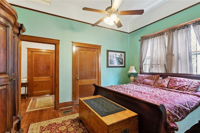 115 N Scott St, New Orleans, LA 70119 - bedroom with wood-type flooring and ceiling fan