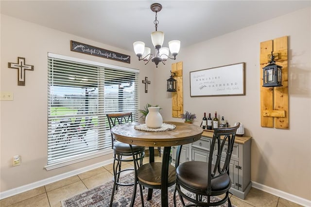 28272 Lake Salvador Dr, Livingston, LA 70754 - dining room featuring a chandelier, light tile patterned floors, and baseboards