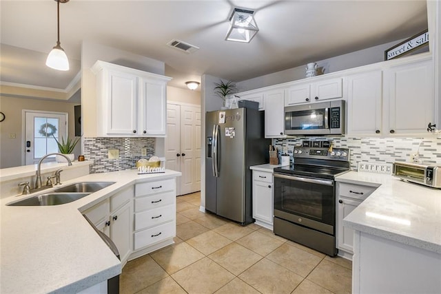 28272 Lake Salvador Dr, Livingston, LA 70754 - kitchen with stainless steel appliances, a sink, backsplash, white cabinetry, and light tile patterned flooring
