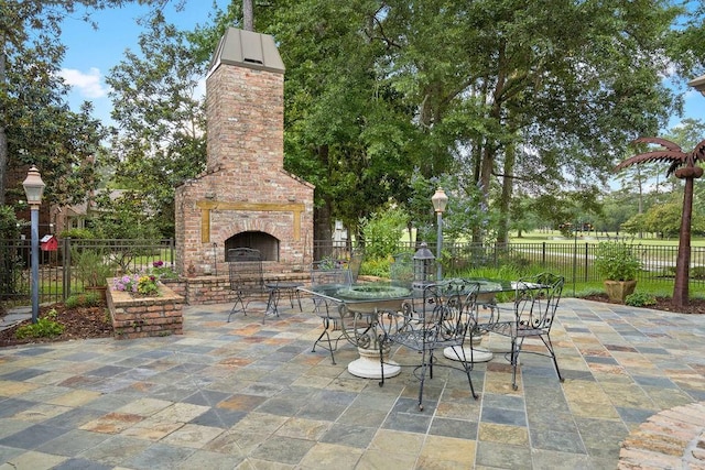 553 Beau Chene Dr, Mandeville, LA 70471 - view of patio with an outdoor brick fireplace