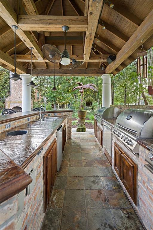 553 Beau Chene Dr, Mandeville, LA 70471 - view of patio with a gazebo and exterior kitchen