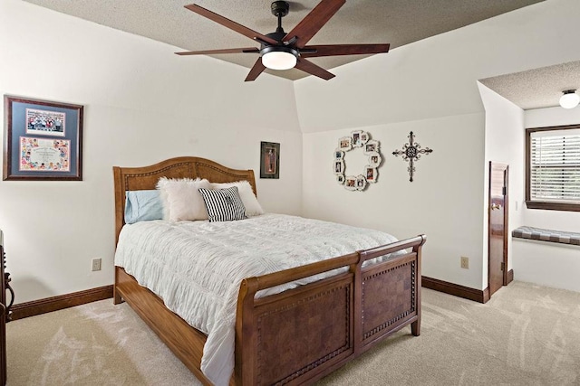 553 Beau Chene Dr, Mandeville, LA 70471 - bedroom featuring light colored carpet, lofted ceiling, ceiling fan, and a textured ceiling