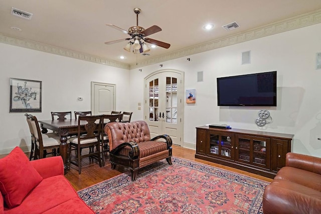 553 Beau Chene Dr, Mandeville, LA 70471 - living room with french doors, wood finished floors, ceiling fan, crown molding, and recessed lighting