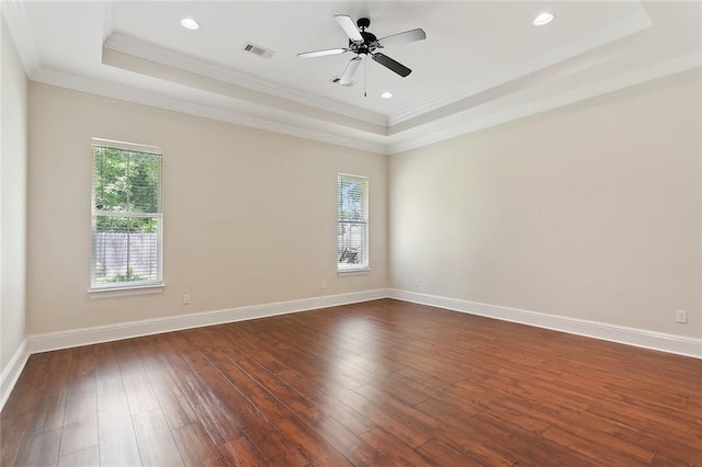 47075 Weald Way, Hammond, LA 70401 - unfurnished room with a raised ceiling, dark wood finished floors, ornamental molding, baseboards, and a ceiling fan