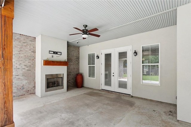 47075 Weald Way, Hammond, LA 70401 - view of patio featuring a fireplace, a ceiling fan, and french doors