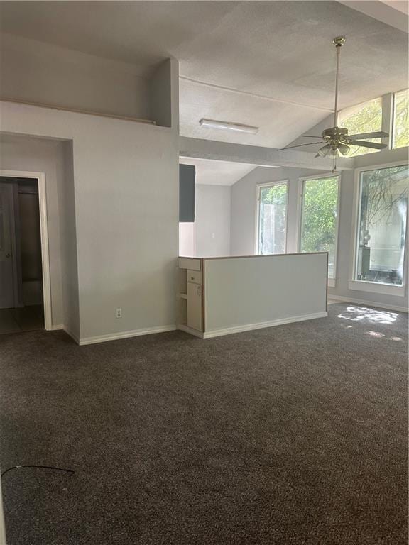 25594 W Spruce St, Lacombe, LA 70445 - unfurnished room featuring lofted ceiling, a ceiling fan, baseboards, and dark carpet