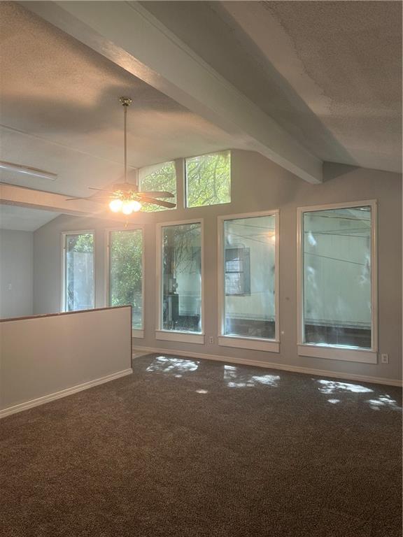 25594 W Spruce St, Lacombe, LA 70445 - carpeted spare room with baseboards and a textured ceiling