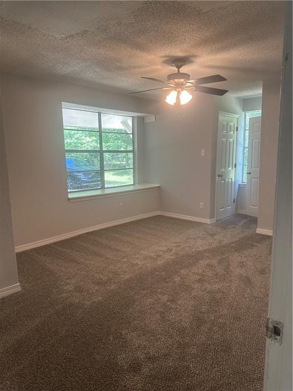25594 W Spruce St, Lacombe, LA 70445 - carpeted spare room featuring a textured ceiling, ceiling fan, and baseboards