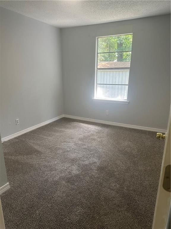 25594 W Spruce St, Lacombe, LA 70445 - carpeted empty room featuring a textured ceiling and baseboards