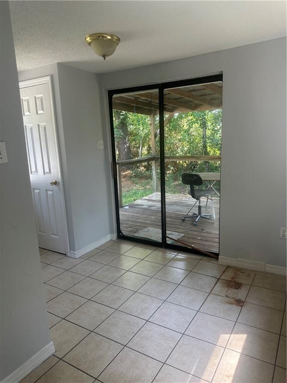 25594 W Spruce St, Lacombe, LA 70445 - unfurnished room with light tile patterned flooring and baseboards