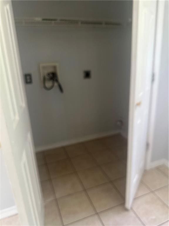 25594 W Spruce St, Lacombe, LA 70445 - laundry room with electric dryer hookup, light tile patterned flooring, hookup for a washing machine, and baseboards