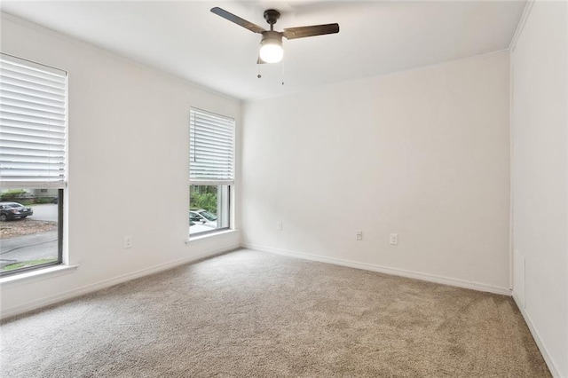 640 Tete Lours Dr Unit 28, Mandeville, LA 70471 - carpeted spare room with ceiling fan, baseboards, and ornamental molding
