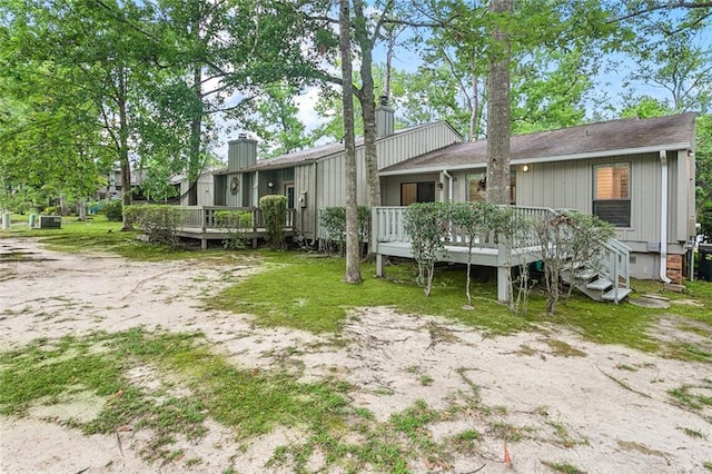640 Tete Lours Dr Unit 28, Mandeville, LA 70471 - rear view of property featuring a wooden deck