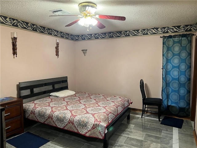 4300 Idaho Ave, Kenner, LA 70065 - bedroom featuring a textured ceiling and a ceiling fan