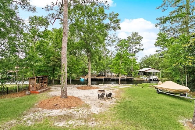 27044 Lucille Dr, Lacombe, LA 70445 - view of green lawn with a water view and view of scattered trees