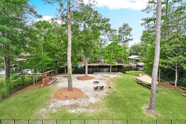 27044 Lucille Dr, Lacombe, LA 70445 - view of yard with a water view, a fire pit, and view of scattered trees