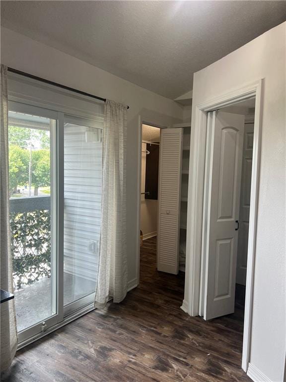 2201 Houma Blvd Unit 303, Metairie, LA 70001 - unfurnished bedroom with dark wood finished floors, baseboards, and a closet