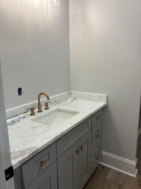 131 Verley Ln, Grand Isle, LA 70358 - bathroom with vanity, baseboards, and wood finished floors