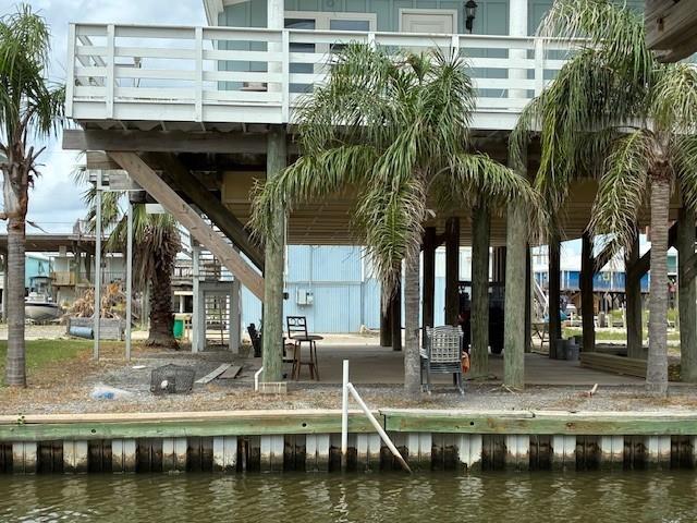 131 Verley Ln, Grand Isle, LA 70358 - surrounding community with a water view and stairway