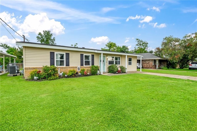 326 Barton Ave, Luling, LA 70070 - ranch-style house with brick siding, concrete driveway, a front lawn, and central AC unit