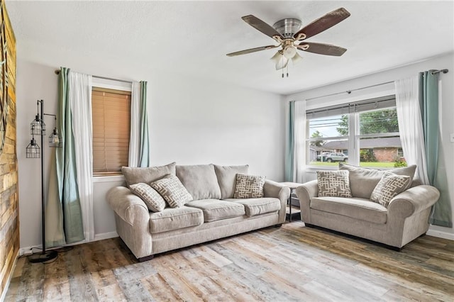 326 Barton Ave, Luling, LA 70070 - living room featuring wood finished floors, ceiling fan, and baseboards