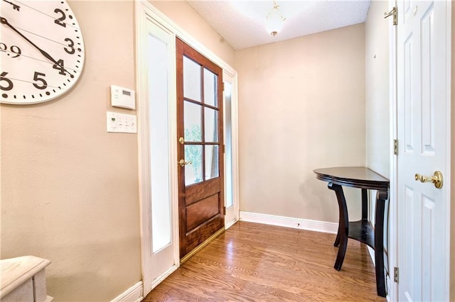 21360 Stire St, Abita Springs, LA 70420 - foyer featuring baseboards and wood finished floors