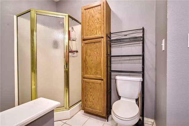 21360 Stire St, Abita Springs, LA 70420 - bathroom with a stall shower, tile patterned flooring, and toilet