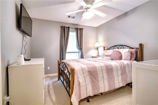 21360 Stire St, Abita Springs, LA 70420 - bedroom with a textured ceiling, light colored carpet, ceiling fan, and baseboards