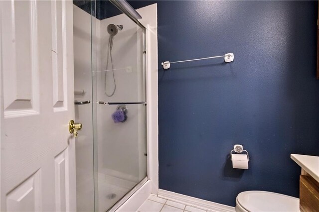21360 Stire St, Abita Springs, LA 70420 - bathroom featuring a shower stall, tile patterned floors, vanity, toilet, and baseboards