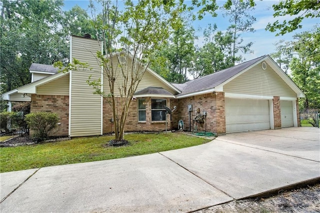 21360 Stire St, Abita Springs, LA 70420 - mid-century home featuring brick siding, driveway, a chimney, a front lawn, and a garage