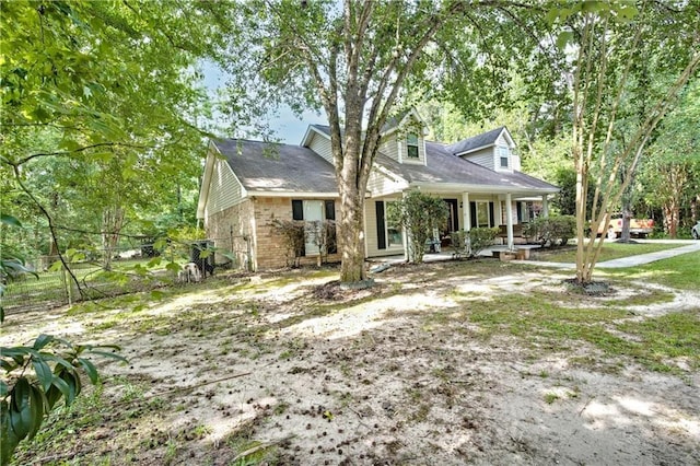 21360 Stire St, Abita Springs, LA 70420 - view of front of property featuring a porch and brick siding