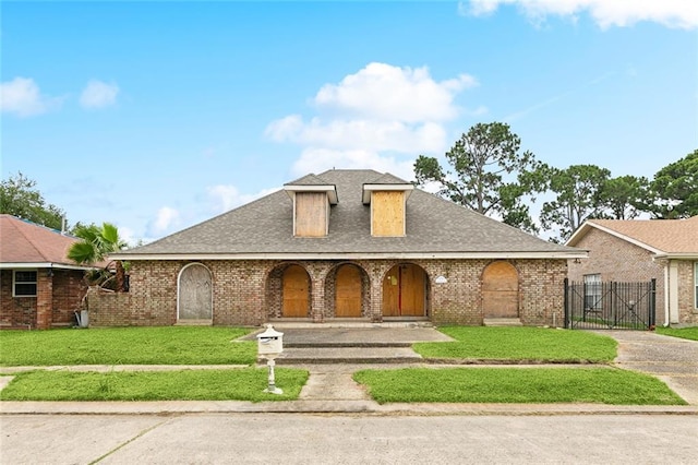 6916 Lake Willow Dr, New Orleans, LA 70126 - view of front of property featuring a gate, a porch, a shingled roof, and brick siding