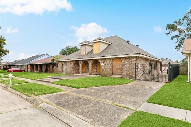 6916 Lake Willow Dr, New Orleans, LA 70126 - view of front of home with brick siding, driveway, roof with shingles, and covered porch